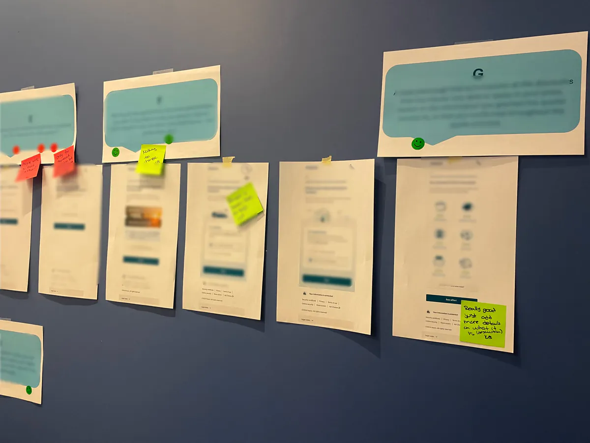 Printed quote screens on the wall, with sticky note feedback from participants
